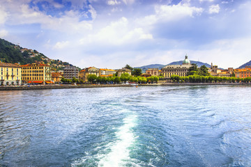Como city in italian lake district from ferry boat. Italy.