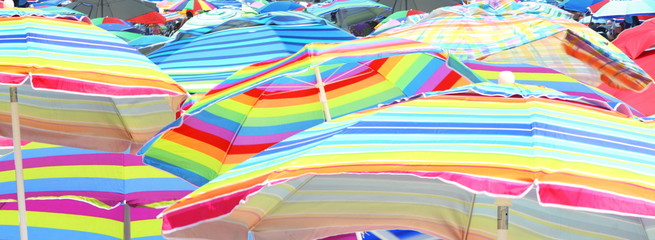 Colorful umbrella closeup on beach