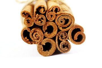 Cinnamon sticks closeup on white background