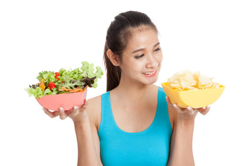 Beautiful Asian healthy girl salad and potato chips