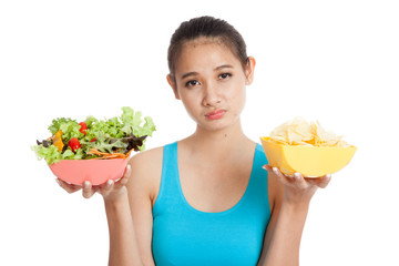Beautiful Asian healthy girl salad and potato chips
