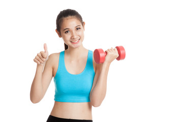 Beautiful Asian healthy girl thumbs up with dumbbell