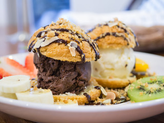Chocolate choux ice cream set with kiwi and strawberry, backgrou