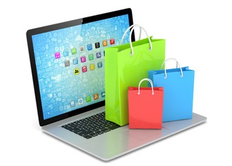 laptop and  shopping pags on white background