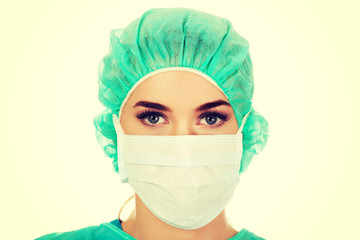 Female surgeon doctor in protective mask