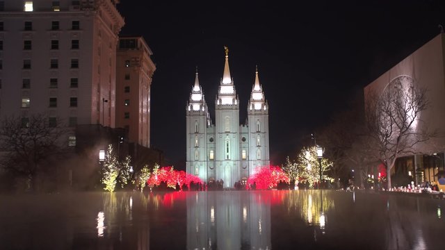 Families mill around the Christmas lights at Temple Square in downtown Salt Lake City, UT.