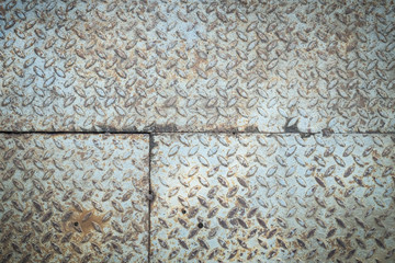 Rusty checkered steel plates texture