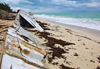 Beached Wrecked Abandoned Boat Skiff on Isla Blanca peninsula on Cancun Bay Mexico