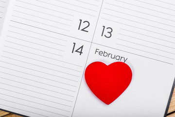 Red Wooden Heart On Calendar. February 14. Valentines Day Concept 