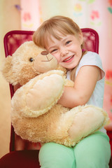Little girl hugging Teddy bear