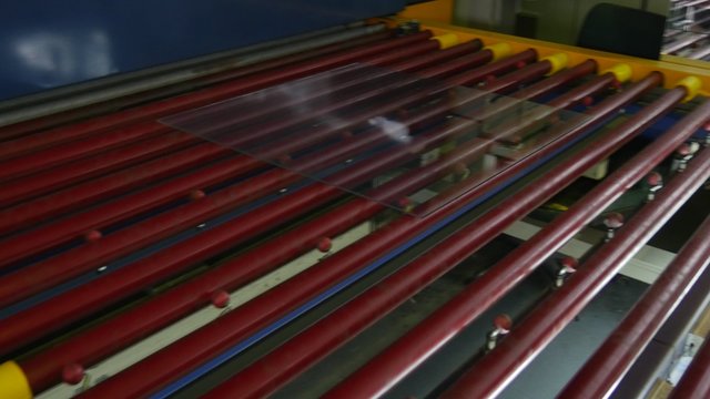 Sheet of Glass is Moving to The Oven, To the Machine, Glass Tempering Machine, Strong Heating in the Oven and Rapid Cooling