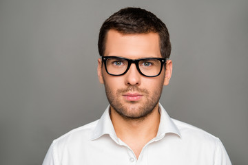 Portrait of serious smart man in glasses