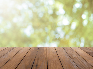 Naklejka na ściany i meble Wooden plank and bright spring bokeh background - can be used for display your products