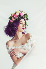 Bridesmaid with purple hair and luxurious wreath on head