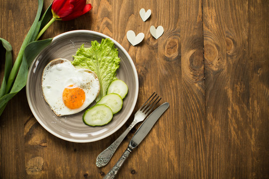 Romantic breakfast with scrambled eggs in Valentine's Day