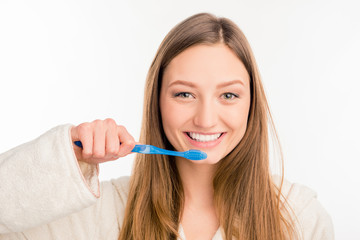 Close up photo of cute girl holding toothbrush
