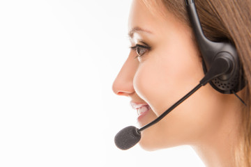 A close-up side-face portrait of a young agent of call centre