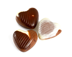 heart-shaped chocolates isolated on white