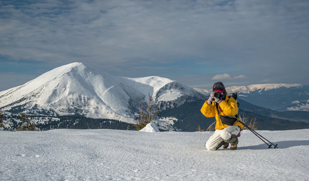 taking landscape shot in winter mountains