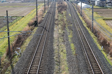 Fototapeta na wymiar 羽越本線の線路（複線）／山形県の庄内地方で羽越本線の線路（複線）を撮影した、ローカルイメージの写真です。