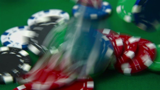 Falling colored poker chips. Slow motion effect