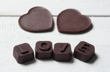 Obraz na płótnie Canvas chocolate Valentine's on rusty wooden