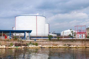 Obraz premium White oil tanks on Black sea coast in Varna port