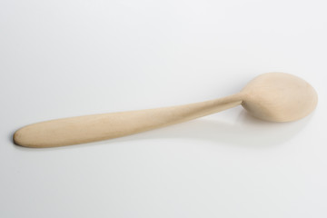 Wooden spoon on white background