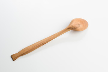 Wooden spoon on white background