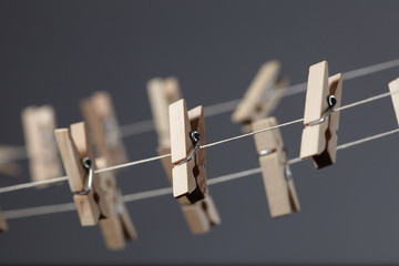 wooden clothespins on a rope