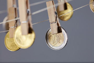 clothespins with coins