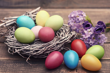 Fototapeta na wymiar Handmade Easter eggs in the nest