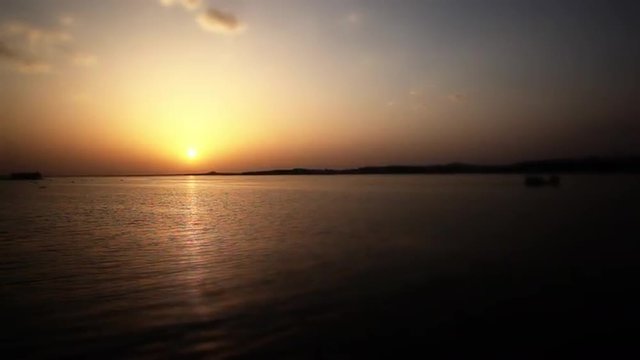 Locked-on shot of a lake at sunset, Bhopal, Madhya Pradesh, India