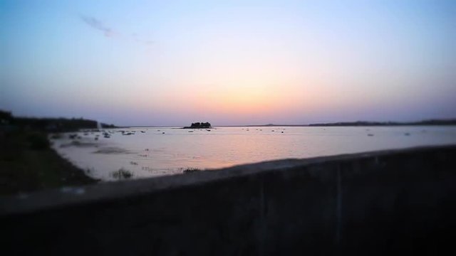 Locked-on shot of a lake at sunset, Bhopal, Madhya Pradesh, India