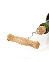 corkscrew and wine bottle on white