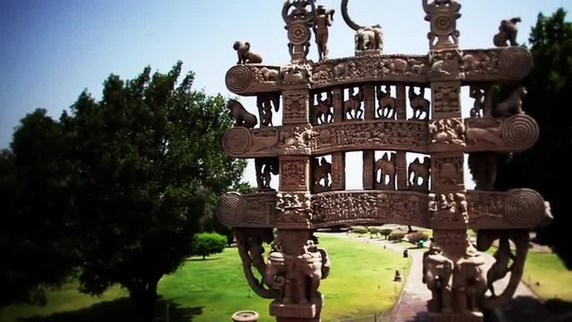 Fade in shot of carved decoration of the Northern torana to the Stupa of Sanchi, Raisen District, Madhya Pradesh, India