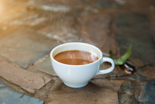 coffee cup and smoke on netural background