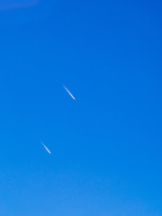 Cloud and jet contrail with blue sky
