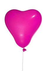 Fototapeta na wymiar single pink heart shape balloon on white