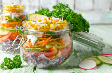 Vegetarian Rainbow salad in a glass jar for summer picnic
