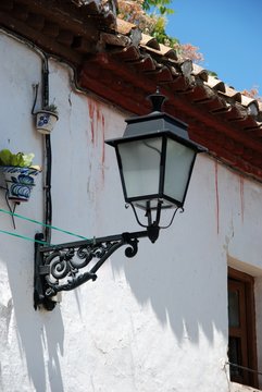 Spanish streetlight on a townhouse, Granada.