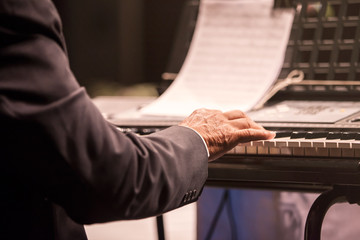 Old man playing piano