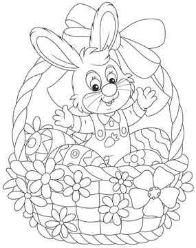 Easter Bunny in a basket with painted eggs, decorated with a red bow and flowers