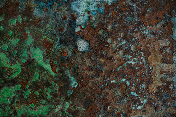 Multicolored background: rusty metal surface flaking and cracking texture