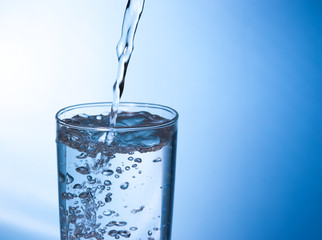 pouring water in glass