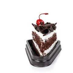 Chocolate cake slice with curl on white background