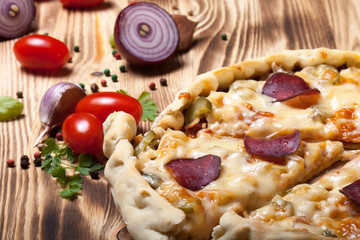 Prepared pizza with smelted cheese. Selective focus