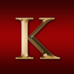 Gold letter "K" on a red background