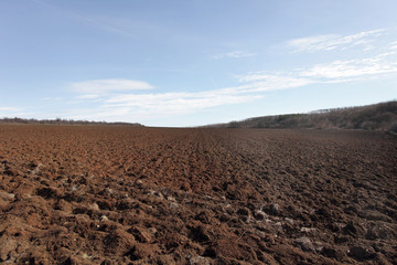 Fototapeta na wymiar Plowed field before planting.