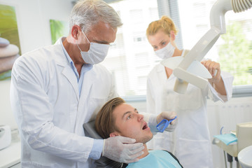 Young man having dental treatment